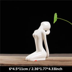 White Ceramic Yoga Figurines